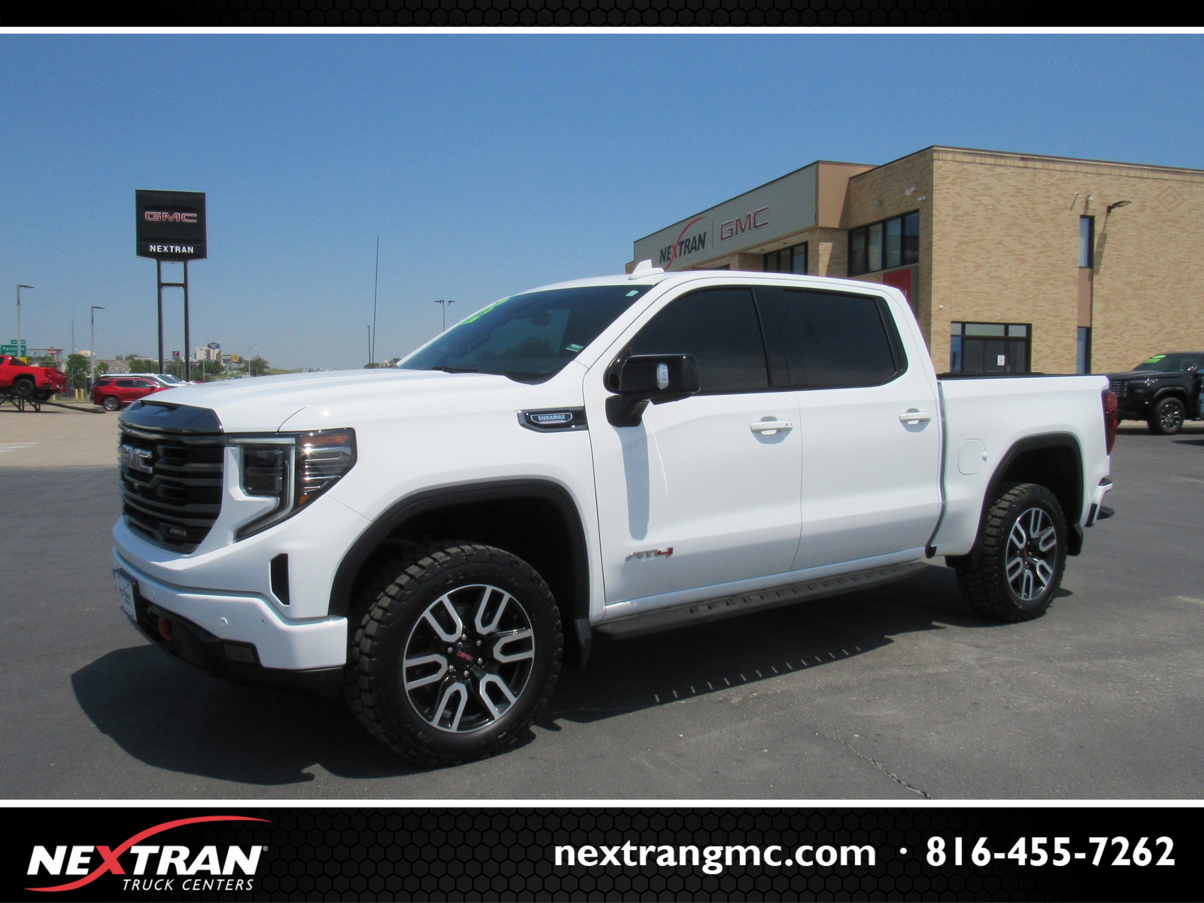 2024 GMC Sierra 1500 AT4 in Summit White — front three-quarter view